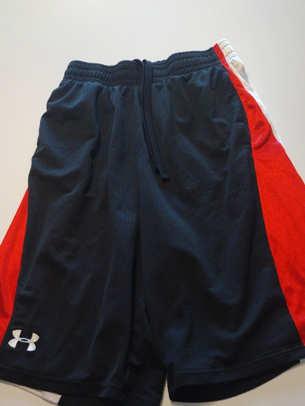 Under Armor Black/ Red/ White Basketball shorts with Red Side Panels. Pre-owned